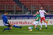 20 November 2022; Alan Browne of Republic of Ireland in action against Malta goalkeeper Henry Bonello during the International Friendly match between Malta and Republic of Ireland at the Ta' Qali National Stadium in Attard, Malta. Photo by Seb Daly/Sportsfile