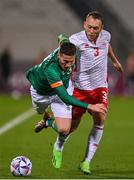 20 November 2022; Matt Doherty of Republic of Ireland is tackled by Ryan Camenzuli of Malta during the International Friendly match between Malta and Republic of Ireland at the Ta' Qali National Stadium in Attard, Malta. Photo by Seb Daly/Sportsfile