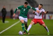 20 November 2022; Matt Doherty of Republic of Ireland is tackled by Ryan Camenzuli of Malta during the International Friendly match between Malta and Republic of Ireland at the Ta' Qali National Stadium in Attard, Malta. Photo by Seb Daly/Sportsfile