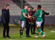 20 November 2022; Evan Ferguson of Republic of Ireland, right, comes on as a substitute for team-mate Chiedozie Ogbene during the International Friendly match between Malta and Republic of Ireland at the Ta' Qali National Stadium in Attard, Malta. Photo by Seb Daly/Sportsfile