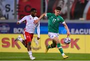 20 November 2022; Callum O'Dowda of Republic of Ireland in action against Joseph Essien Mbong of Malta during the International Friendly match between Malta and Republic of Ireland at the Ta' Qali National Stadium in Attard, Malta. Photo by Seb Daly/Sportsfile
