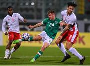 20 November 2022; Evan Ferguson of Republic of Ireland in action against Kurt Shaw of Malta during the International Friendly match between Malta and Republic of Ireland at the Ta' Qali National Stadium in Attard, Malta. Photo by Seb Daly/Sportsfile