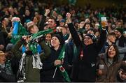 19 November 2022; Ireland supporters celebrate a try during the Bank of Ireland Nations Series match between Ireland and Australia at the Aviva Stadium in Dublin. Photo by Ramsey Cardy/Sportsfile