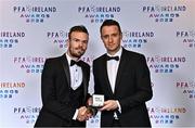 19 November 2022; Cameron Dummigan of Derry City, left, is presented with his PFA Ireland Premier Division Team of the Year Medal by PFA Ireland Chairperson Brendan Clarke during the PFA Ireland Awards 2022 at the Marker Hotel in Dublin. Photo by Sam Barnes/Sportsfile