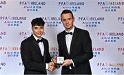 19 November 2022; Phoenix Patterson of Waterford FC, left, is presented with his PFA Ireland First Division Team of the Year Medal by PFA Ireland Chairperson Brendan Clarke during the PFA Ireland Awards 2022 at the Marker Hotel in Dublin. Photo by Sam Barnes/Sportsfile