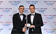 19 November 2022; Enda Curran of Treaty United, left, is presented with his PFA Ireland First Division Team of the Year Medal by PFA Ireland Chairperson Brendan Clarke during the PFA Ireland Awards 2022 at the Marker Hotel in Dublin. Photo by Sam Barnes/Sportsfile