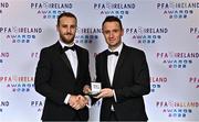 19 November 2022; Ally Gilchrist of Cork City, left, is presented with his PFA Ireland First Division Team of the Year Medal by PFA Ireland Chairperson Brendan Clarke during the PFA Ireland Awards 2022 at the Marker Hotel in Dublin. Photo by Sam Barnes/Sportsfile