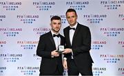 19 November 2022; Aaron Bolger of Cork City, left, is presented with his PFA Ireland First Division Team of the Year Medal by PFA Ireland Chairperson Brendan Clarke during the PFA Ireland Awards 2022 at the Marker Hotel in Dublin. Photo by Sam Barnes/Sportsfile