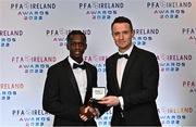 19 November 2022; Armando Junior Quitirna of Waterford FC, left, is presented with his PFA Ireland First Division Team of the Year Medal by PFA Ireland Chairperson Brendan Clarke during the PFA Ireland Awards 2022 at the Marker Hotel in Dublin.. Photo by Sam Barnes/Sportsfile