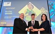 23 November 2022; Inspirational Performance on Irish Soil winner Nick Griggs, centre, is presented with his award by Athletics Ireland President John Cronin, left, and RSA Insurance Managing Director Elaine Robinson, during the 123.ie National Athletics Awards at the Crowne Plaza Hotel in Santry, Dublin. A full list of winners from the event can be found at AthleticsIreland.ie. Photo by Sam Barnes/Sportsfile