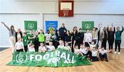 24 November 2022; Republic of Ireland international Evan Ferguson with pupils and staff from Scoil Chiaráin  during the launch of Football for All - Futsal in the Yard programme at the Scoil Chiaráin in Glasnevin, Dublin. Photo by Eóin Noonan/Sportsfile