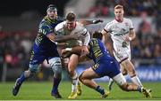 25 November 2022; Jake Flannery of Ulster is tackled by Jan Uys, left, and Enrico Lucchin of Zebre Parma during the United Rugby Championship match between Ulster and Zebre Parma at Kingspan Stadium in Belfast. Photo by Ramsey Cardy/Sportsfile