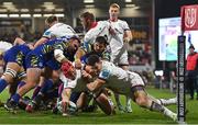 25 November 2022; Tom Stewart of Ulster dives over to score his side's first try., with the assistance of Jacob Stockdale, right, during the United Rugby Championship match between Ulster and Zebre Parma at Kingspan Stadium in Belfast. Photo by Ramsey Cardy/Sportsfile
