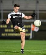 26 November 2022; Aaron Branagan of Kilcoo kicks a point during the AIB Ulster GAA Football Senior Club Championship Semi-Final match between Enniskillen Gaels and Kilcoo at Athletic Grounds in Armagh. Photo by Oliver McVeigh/Sportsfile