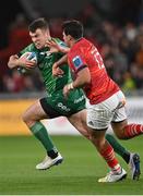 26 November 2022; Tom Farrell of Connacht in action against Antoine Frisch of Munster during the United Rugby Championship match between Munster and Connacht at Thomond Park in Limerick. Photo by Piaras Ó Mídheach/Sportsfile