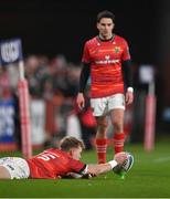 26 November 2022; Mike Haley of Munster holds the ball in place for teammate Joey Carbery for a conversion attempt during the United Rugby Championship match between Munster and Connacht at Thomond Park in Limerick. Photo by Piaras Ó Mídheach/Sportsfile
