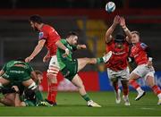26 November 2022; Caolin Blade of Connacht kicks under pressure from Josh Wycherley of Munster during the United Rugby Championship match between Munster and Connacht at Thomond Park in Limerick. Photo by Piaras Ó Mídheach/Sportsfile