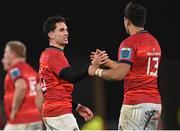 26 November 2022; Joey Carbery of Munster shakes hands with teammate Antoine Frisch, 13, after their side's victory in the United Rugby Championship match between Munster and Connacht at Thomond Park in Limerick. Photo by Piaras Ó Mídheach/Sportsfile