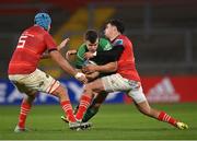 26 November 2022; Tom Farrell of Connacht is tackled by Tadhg Beirne, left, and Joey Carbery of Munster during the United Rugby Championship match between Munster and Connacht at Thomond Park in Limerick. Photo by Piaras Ó Mídheach/Sportsfile