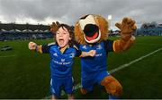 26 November 2022; Matchday mascot Jack Forde, from Harolds Cross, Dublin, with Leo the Lion before the United Rugby Championship match between Leinster and Glasgow Warriors at RDS Arena in Dublin. Photo by Ramsey Cardy/Sportsfile