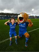 26 November 2022; Matchday mascot Jack Forde, from Harolds Cross, Dublin, with Leo the Lion before the United Rugby Championship match between Leinster and Glasgow Warriors at RDS Arena in Dublin. Photo by Ramsey Cardy/Sportsfile