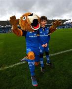 26 November 2022; Matchday mascot Eduardo McFeely, from Portmarnock, Dublin, with Leo the Lion before the United Rugby Championship match between Leinster and Glasgow Warriors at RDS Arena in Dublin. Photo by Ramsey Cardy/Sportsfile