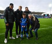 26 November 2022; Mascot Eduardo McFeely, aged nine, with Leinster players, from left, Michael Ala'alatoa, Tommy O'Brien and Jordan Larmour at the United Rugby Championship match between Leinster and Glasgow Warriors at RDS Arena in Dublin. Photo by Harry Murphy/Sportsfile