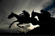 27 November 2022; Scarbrook, left, with Kevin Sexton up, and New Year Honours, with Jack Kennedy up, jump the last during the Bar One Racing 3-Y-O Maiden Hurdle at Navan Racecourse in Meath. Photo by Seb Daly/Sportsfile