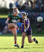 27 November 2022; Aoibhe O' Shea of Mullinahone in action against Emily Cassidy of Derrygonnelly Harps during the CurrentAccount.ie LGFA All-Ireland Intermediate Club Championship Semi-Final match between Mullinahone, Tipperary, and Derrygonnelly, Fermanagh, at John Locke Park in Callan, Kilkenny. Photo by David Fitzgerald/Sportsfile