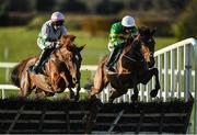 27 November 2022; Dawn Rising, right, with Mark Walsh up, jumps the fifth on their way to winning the John Lynch Carpets & Flooring Monksfield Novice Hurdle, from eventual third place Kilbarry Chloe, with Mike O'Connor up, at Navan Racecourse in Meath. Photo by Seb Daly/Sportsfile