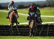 27 November 2022; Affordale Fury and jockey Bryan Cooper, right, fall at the last, alongside eventual second place American Mike, with Jack Kennedy up, during the John Lynch Carpets & Flooring Monksfield Novice Hurdle at Navan Racecourse in Meath. Photo by Seb Daly/Sportsfile