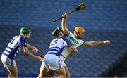 27 November 2022; Ross Kelly of Naas, supported by team mate Peter O’Donoghue, left, tackles and fouls Colin Fennelly of Shamrocks Ballyhale and conceedes a penalty during the AIB Leinster GAA Hurling Senior Club Championship Semi-Final match between Naas and Shamrocks Ballyhale at Croke Park in Dublin. Photo by Daire Brennan/Sportsfile