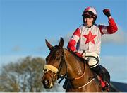 27 November 2022; Jockey Keith Donoghue celebrates on The Big Dog after winning the Bar One Racing Troytown Handicap Steeplechase at Navan Racecourse in Meath. Photo by Seb Daly/Sportsfile