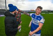27 November 2022; Barry John Keane of Kerins O'Rahillys celebrates with a supporter after the AIB Munster GAA Football Senior Club Championship Semi-Final match between Kerins O’Rahillys and Éire Óg Ennis at Austin Stack Park in Tralee, Kerry. Photo by Eóin Noonan/Sportsfile