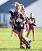 27 November 2022; Emily Cassidy of Derrygonnelly Harps in action against Aoibhe O'Shea of Mullinahone during the CurrentAccount.ie LGFA All-Ireland Intermediate Club Championship Semi-Final match between Mullinahone, Tipperary, and Derrygonnelly, Fermanagh, at John Locke Park in Callan, Kilkenny. Photo by David Fitzgerald/Sportsfile