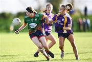 27 November 2022; Chloe Gunn of Mullinahone in action against Niamh Smyth of Derrygonnelly Harps during the CurrentAccount.ie LGFA All-Ireland Intermediate Club Championship Semi-Final match between Mullinahone, Tipperary, and Derrygonnelly, Fermanagh, at John Locke Park in Callan, Kilkenny. Photo by David Fitzgerald/Sportsfile