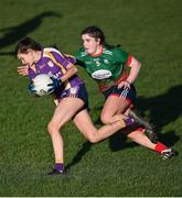 27 November 2022; Bronagh Smyth of Derrygonnelly Harps in action against Emma Cody of Mullinahone during the CurrentAccount.ie LGFA All-Ireland Intermediate Club Championship Semi-Final match between Mullinahone, Tipperary, and Derrygonnelly, Fermanagh, at John Locke Park in Callan, Kilkenny. Photo by David Fitzgerald/Sportsfile