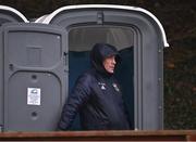 27 November 2022; A supporter shelters from heavy rain in a portable toilet during the CurrentAccount.ie LGFA All-Ireland Junior Club Championship Semi-Final match between Salthill Knocknacarra, Galway, and O’Dwyer's, Dublin, at The Prairie in Salthill, Galway. Photo by Piaras Ó Mídheach/Sportsfile