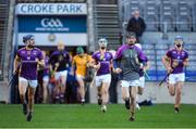 27 November 2022; Caolán Conway, right, of Kilmacud Crokes leads his side out in advance of the AIB Leinster GAA Hurling Senior Club Championship Semi-Final match between Naomh Moling and Kilmacud Crokes at Croke Park in Dublin. Photo by Daire Brennan/Sportsfile