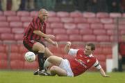 31 May 2004; Glen Crowe, Bohemians, in action against Stephen McGuinness, St. Patrick's Athletic. eircom league, Premier Division, Bohemians v St. Patrick's Athletic, Dalymount Park, Dublin. Picture credit; Pat Murphy / SPORTSFILE