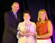 29 May 2004; Elizabeth Hannon, Principal of Calasanctuis College, Oranmore, Galway receives the Girls School of the Year award from Tony Colgan, left, President of Basketball Ireland and Ardine O'Neill, right, Basketball Ireland Board Member, at the Basketball Ireland annual awards at the Burlington Hotel, Dublin. Picture credit; Brendan Moran / SPORTSFILE