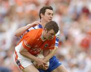 23 May 2004; Ronan Clarke, Armagh, in action against Gary McQuaid, Monaghan. Bank of Ireland Ulster Senior Football Championship, Monaghan v Armagh, St. Tighernach's Park, Clones, Co. Monaghan. Picture credit; Pat Murphy / SPORTSFILE