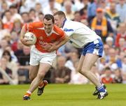 23 May 2004; Martin O'Rourke, Armagh, in action against Vincent Corey, Monaghan. Bank of Ireland Ulster Senior Football Championship, Monaghan v Armagh, St. Tighernach's Park, Clones, Co. Monaghan. Picture credit; Pat Murphy / SPORTSFILE