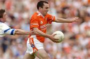 23 May 2004; Martin O'Rourke, Armagh, in action against Gary McQuaid, Monaghan. Bank of Ireland Ulster Senior Football Championship, Monaghan v Armagh, St. Tighernach's Park, Clones, Co. Monaghan. Picture credit; Pat Murphy / SPORTSFILE