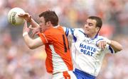 23 May 2004; Ronan Clarke, Armagh, in action against Monaghan's John Paul Mone. Bank of Ireland Ulster Senior Football Championship, Monaghan v Armagh, St. Tighernach's Park, Clones, Co. Monaghan. Picture credit; Pat Murphy / SPORTSFILE