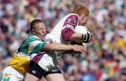 23 May 2004; Denis Glennon, Offaly, tackles Westmeath goalkeeper Gary Connaughton. Bank of Ireland Leinster Senior Football Championship, Offaly v Westmeath, Croke Park, Dublin. Picture credit; Brian Lawless / SPORTSFILE