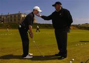 1 June 2004; World leading golf coach Butch Harmon adjusts the technique of Ciaran Ryan, Elm Park Golf Club, Dublin, at the Red Bull masterclass. Portmarnock Golf Club, Portmarnock, Co. Dublin. Picture credit; David Maher / SPORTSFILE