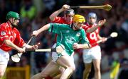 30 May 2004; Niall Moran, Limerick, is tackled by Jerry O'Connor, left, and John Gardiner, Cork. Guinness Munster Senior Hurling Championship Semi-Final, Limerick v Cork, Gaelic Grounds, Limerick. Picture credit; Ray McManus / SPORTSFILE