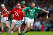 30 May 2004; Clem Smith, Limerick, is tackled by Michael O'Connell, Cork. Guinness Munster Senior Hurling Championship Semi-Final, Limerick v Cork, Gaelic Grounds, Limerick. Picture credit; Ray McManus / SPORTSFILE