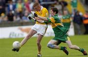 30 May 2004; Aron Douglas, Antrim, in action against Conal McNeilis, Donegal. Ulster Minor Football Championship, Donegal v Antrim, McCool Park, Ballybofey, Co. Donegal. Picture credit; Damien Eagers / SPORTSFILE